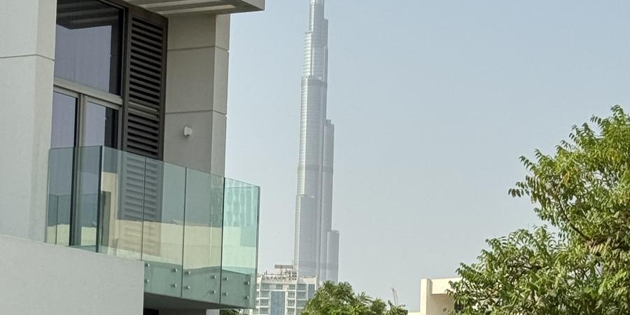 A modern villa with a view of Burj Khalifa, Dubai (representative villa, not JVC itself)